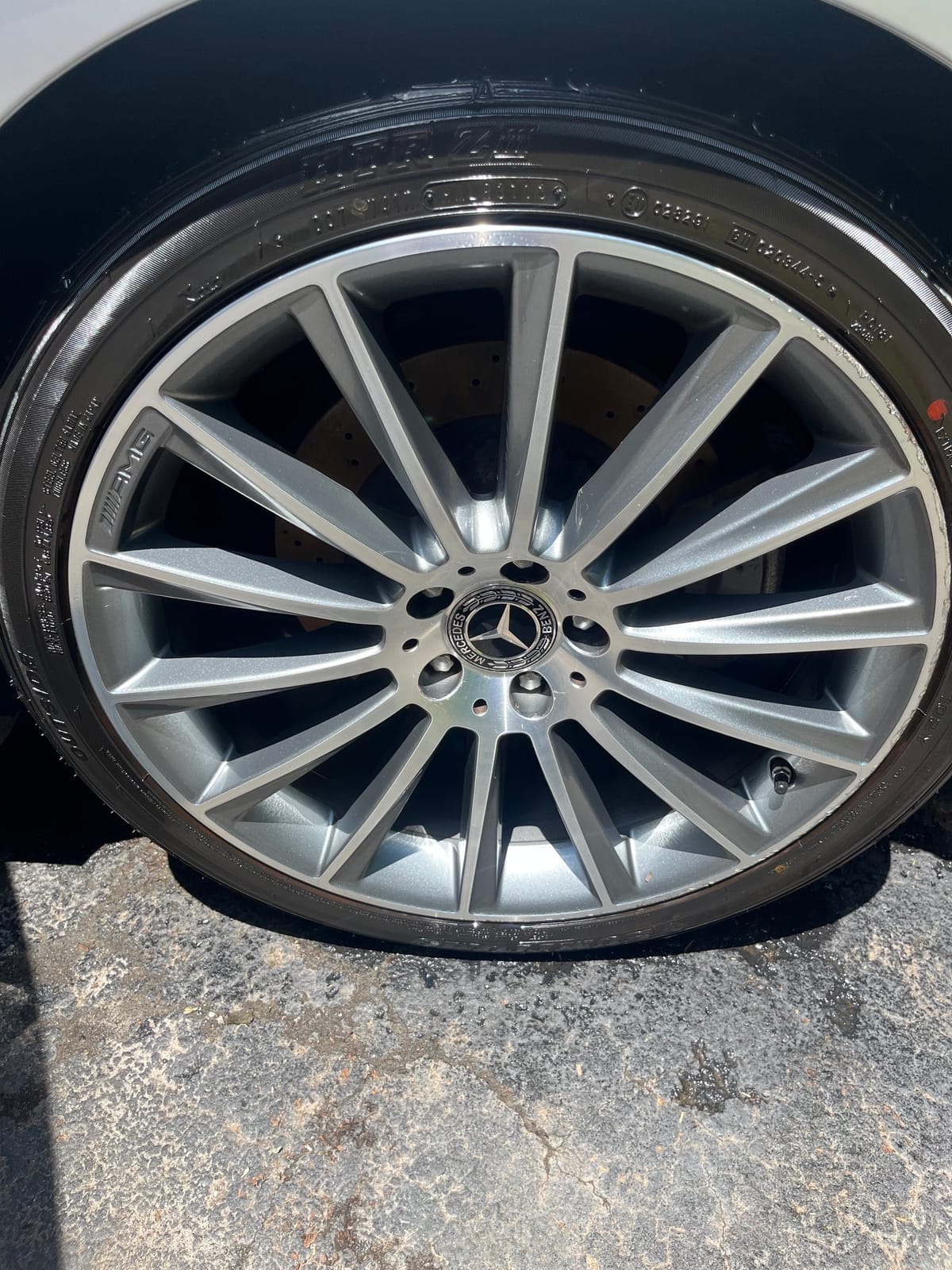 The same Mercedes AMG wheel cleaned and dressed after Peachtree Mobile Detail