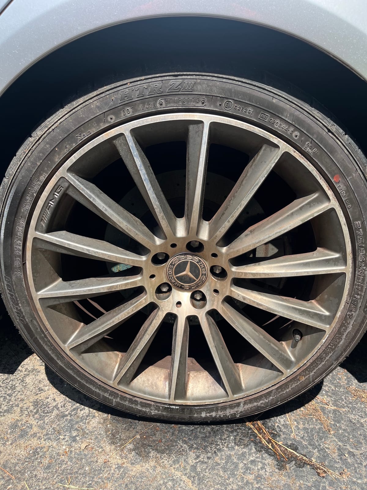 A Mercedes AMG wheel caked in brake dust before Peachtree Mobile Detail